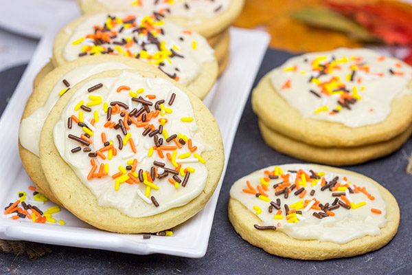 The crisp Fall air (and baking season) is back!  Celebrate the season with a batch of these tasty Frosted Maple Sugar Cookies!