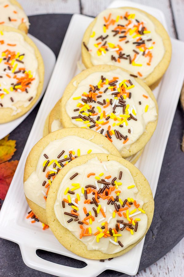 The crisp Fall air (and baking season) is back!  Celebrate the season with a batch of these tasty Frosted Maple Sugar Cookies!