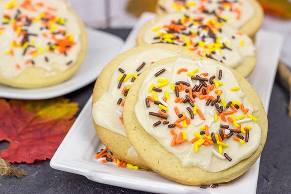 The crisp Fall air (and baking season) is back!  Celebrate the season with a batch of these tasty Frosted Maple Sugar Cookies!