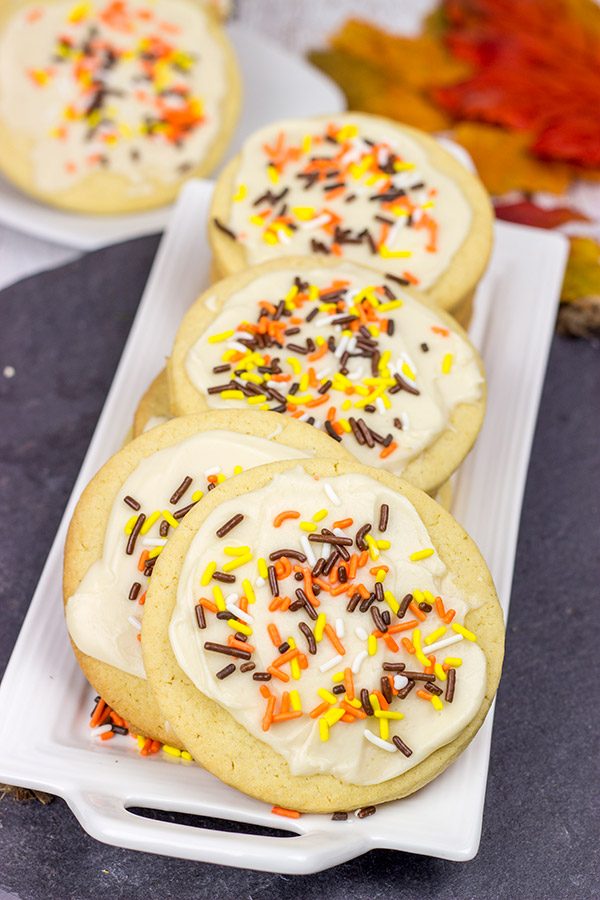 The crisp Fall air (and baking season) is back!  Celebrate the season with a batch of these tasty Frosted Maple Sugar Cookies!