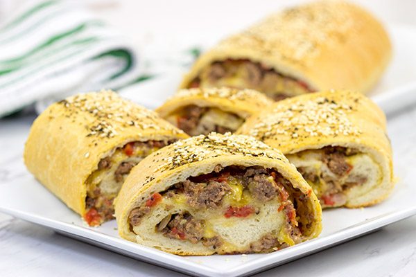 Start with your favorite burger toppings, roll 'em up in pizza dough, and you end up with these tasty (and fun!) Cheeseburger Rollups!