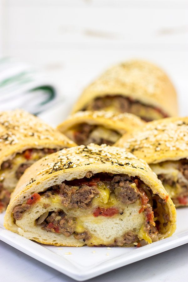 Start with your favorite burger toppings, roll 'em up in pizza dough, and you end up with these tasty (and fun!) Cheeseburger Rollups!