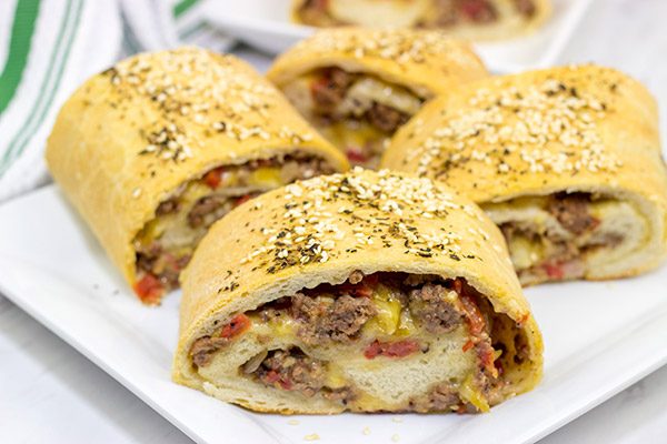 Start with your favorite burger toppings, roll 'em up in pizza dough, and you end up with these tasty (and fun!) Cheeseburger Rollups!