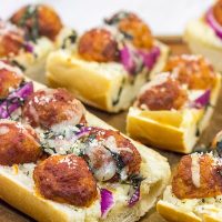This Meatball Parm French Bread Pizza features garlic butter, melty cheese and meatballs. Pizza night just got even more delicious!