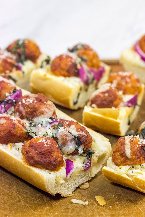 This Meatball Parm French Bread Pizza features garlic butter, melty cheese and meatballs.  Pizza night just got even more delicious!