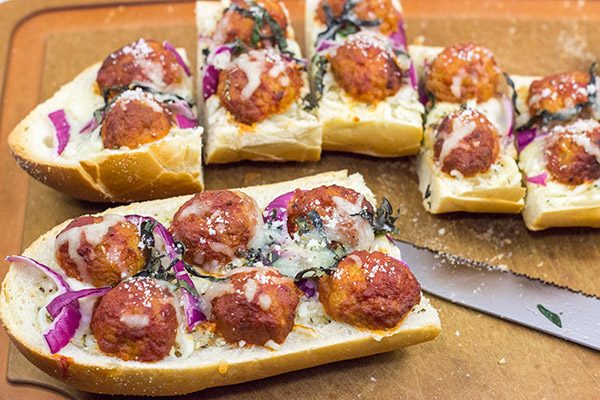 This Meatball Parm French Bread Pizza features garlic butter, melty cheese and meatballs.  Pizza night just got even more delicious!