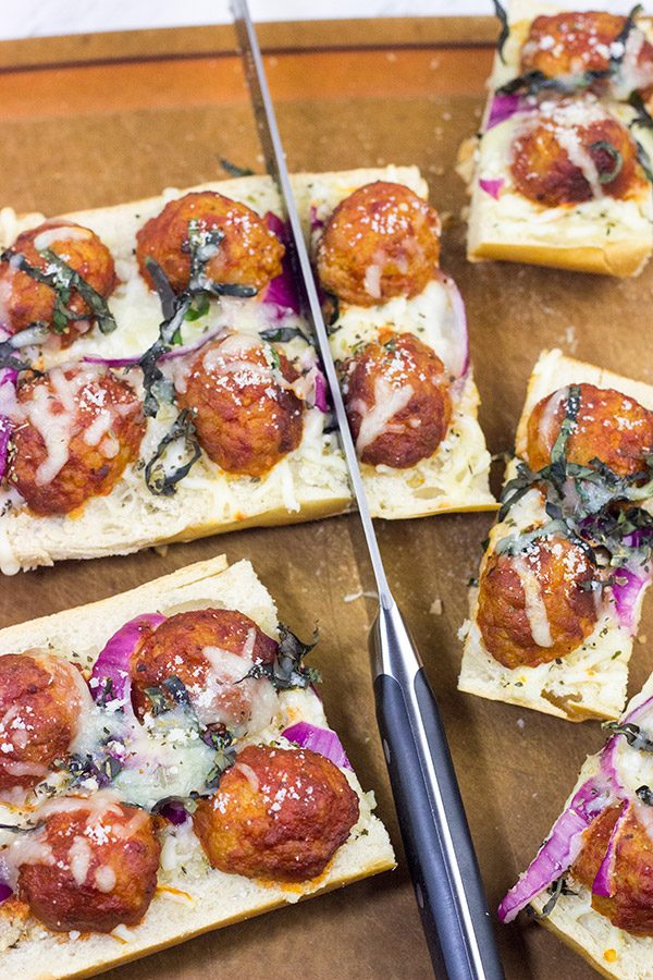 This Meatball Parm French Bread Pizza features garlic butter, melty cheese and meatballs. Pizza night just got even more delicious!