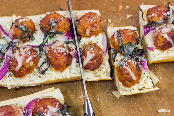 This Meatball Parm French Bread Pizza features garlic butter, melty cheese and meatballs.  Pizza night just got even more delicious!