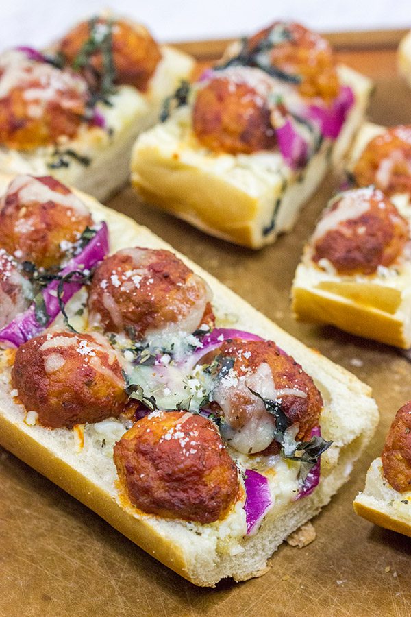 This Meatball Parm French Bread Pizza features garlic butter, melty cheese and meatballs.  Pizza night just got even more delicious!