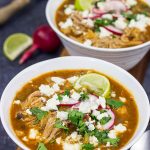 Slow Cooker Pork Posole is an easy dish to make on chilly Fall and Winter days.  It's packed with shredded pork and traditional Mexican flavors for a hearty and delicious meal!
