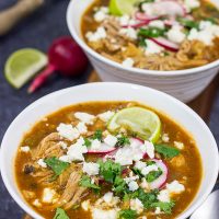 Slow Cooker Pork Posole is an easy dish to make on chilly Fall and Winter days.  It's packed with shredded pork and traditional Mexican flavors for a hearty and delicious meal!