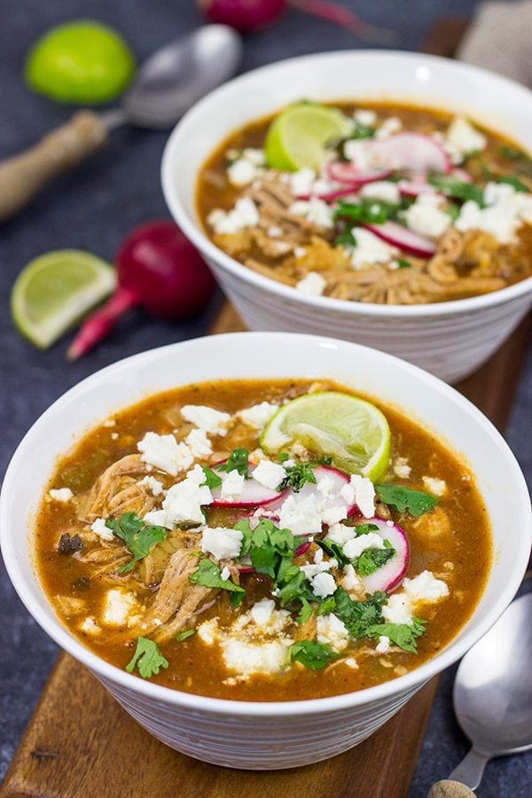 Slow Cooker Pork Posole is an easy dish to make on chilly Fall and Winter days.  It's packed with shredded pork and traditional Mexican flavors for a hearty and delicious meal!