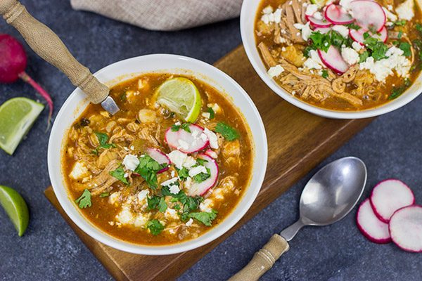 Slow Cooker Pork Posole is an easy dish to make on chilly Fall and Winter days.  It's packed with shredded pork and traditional Mexican flavors for a hearty and delicious meal!