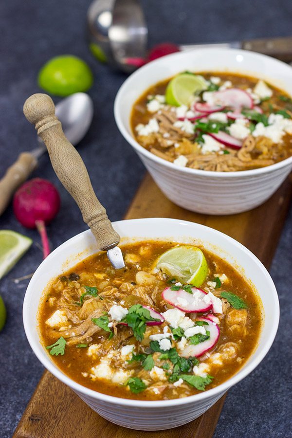Slow Cooker Pork Posole is an easy dish to make on chilly Fall and Winter days.  It's packed with shredded pork and traditional Mexican flavors for a hearty and delicious meal!