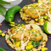 These Spicy Fish Tostadas with Pineapple Salsa are a fun combination of sweet and savory flavors...and they're perfect for either weeknight or weekend meals!