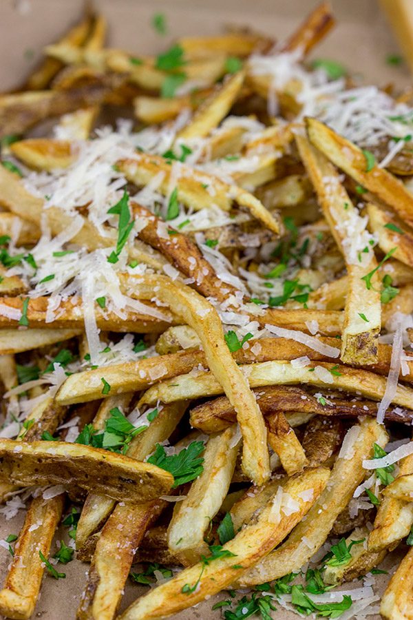 Looking for a unique (and trendy!) side dish?  These Parmesan Truffle Fries are tossed with truffle oil and topped with freshly grated Parmesan cheese.  Enjoy!