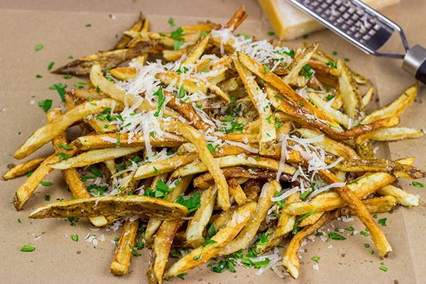 Looking for a unique (and trendy!) side dish?  These Parmesan Truffle Fries are tossed with truffle oil and topped with freshly grated Parmesan cheese.  Enjoy!