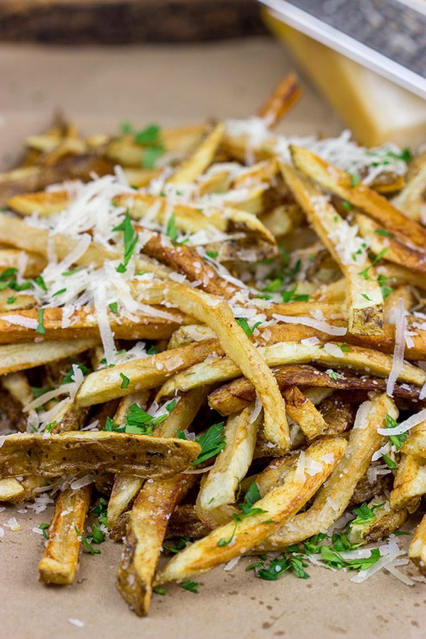 Looking for a unique (and trendy!) side dish?  These Parmesan Truffle Fries are tossed with truffle oil and topped with freshly grated Parmesan cheese.  Enjoy!