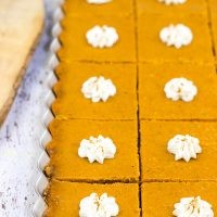 These Pumpkin Pie Bars feature a gingersnap cookie base, and they're the perfect sweet treat for Thanksgiving and holiday parties!