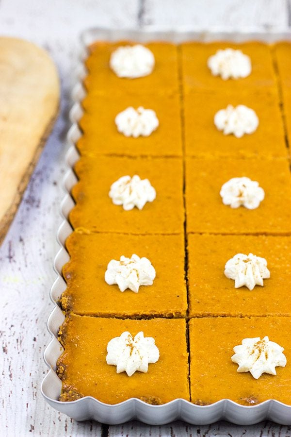 These Pumpkin Pie Bars feature a gingersnap cookie base, and they're the perfect sweet treat for Thanksgiving and holiday parties!