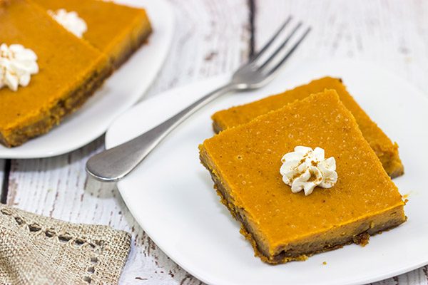 These Pumpkin Pie Bars feature a gingersnap cookie base, and they're the perfect sweet treat for Thanksgiving and holiday parties!