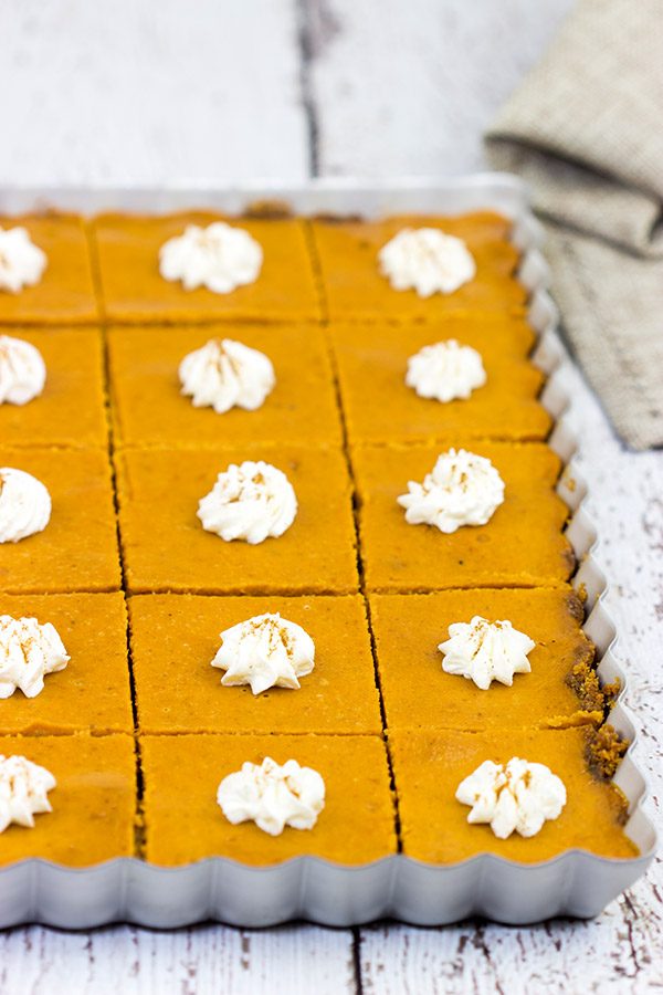 These Pumpkin Pie Bars feature a gingersnap cookie base, and they're the perfect sweet treat for Thanksgiving and holiday parties!
