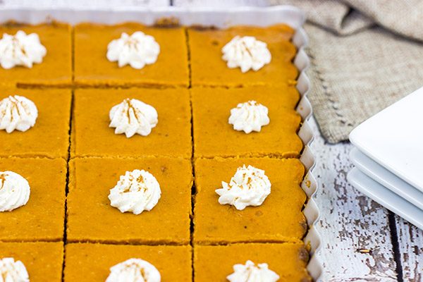 These Pumpkin Pie Bars feature a gingersnap cookie base, and they're the perfect sweet treat for Thanksgiving and holiday parties!