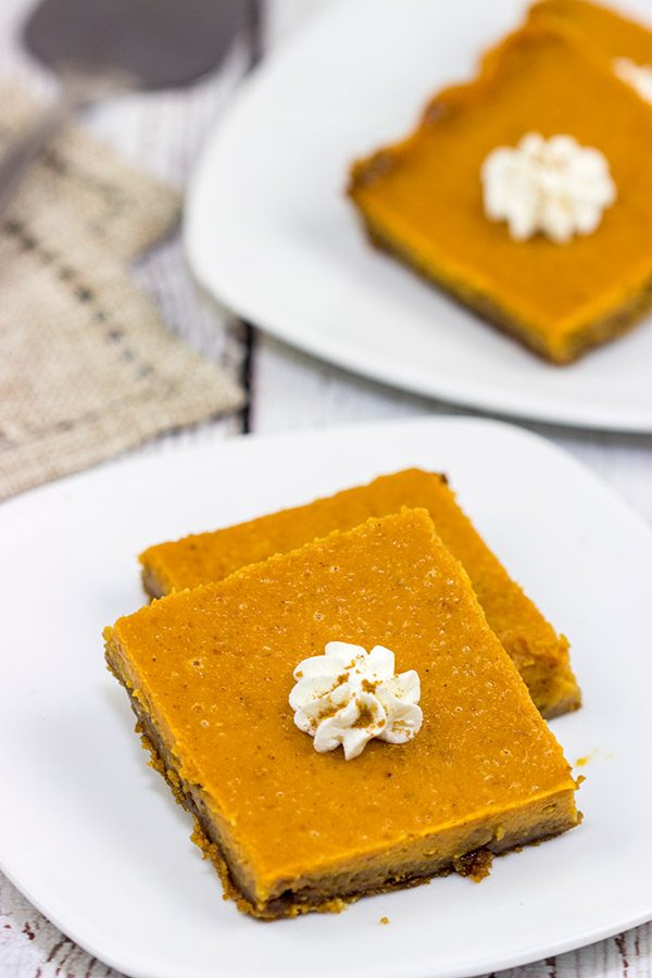 These Pumpkin Pie Bars feature a gingersnap cookie base, and they're the perfect sweet treat for Thanksgiving and holiday parties!