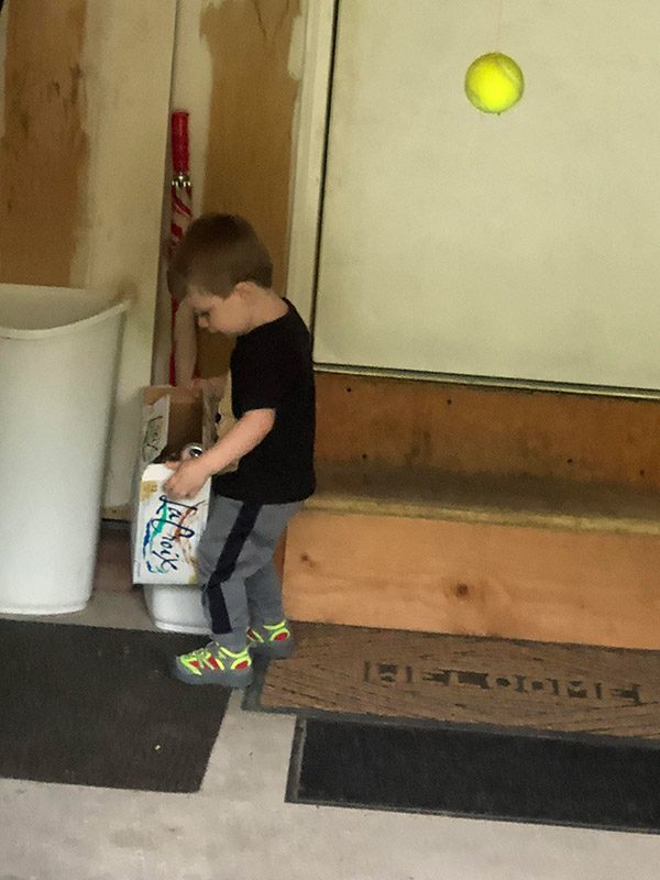 Robbie packing cans