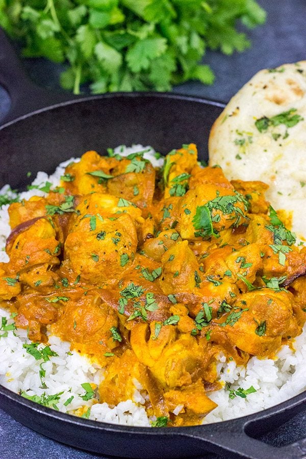 Skip the take-out and make this Chicken Tikka Masala at home! Simmered in a flavorful yogurt marinade, this classic Indian dish is packed with incredible flavor!