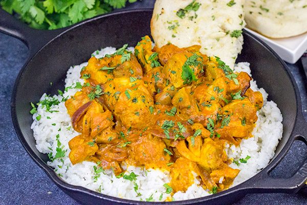 Skip the take-out and make this Chicken Tikka Masala at home!  Simmered in a flavorful yogurt marinade, this classic Indian dish is packed with incredible flavor!