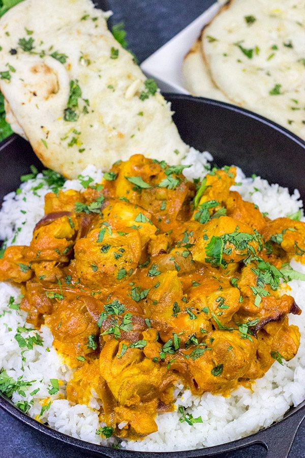 Skip the take-out and make this Chicken Tikka Masala at home!  Simmered in a flavorful yogurt marinade, this classic Indian dish is packed with incredible flavor!