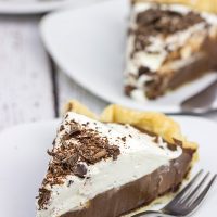 This classic Chocolate Cream Pie recipe features a silky smooth chocolate filling topped with creamy whipped cream. Sprinkle some shaved chocolate on top, and you've got a delicious dessert to share!
