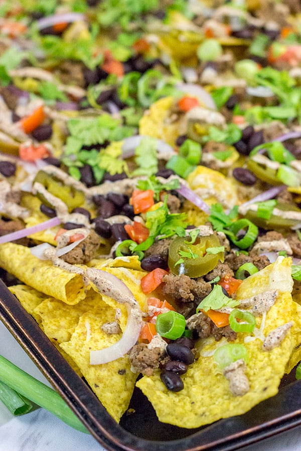 These Ground Beef Nachos are a classic sports food! Grab a plate, turn on the game and enjoy!