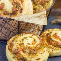 Instead of cinnamon and sugar, these Parmesan Cheese Rolls are stuffed with Italian herbs and cheeses...I dare you to eat just one!