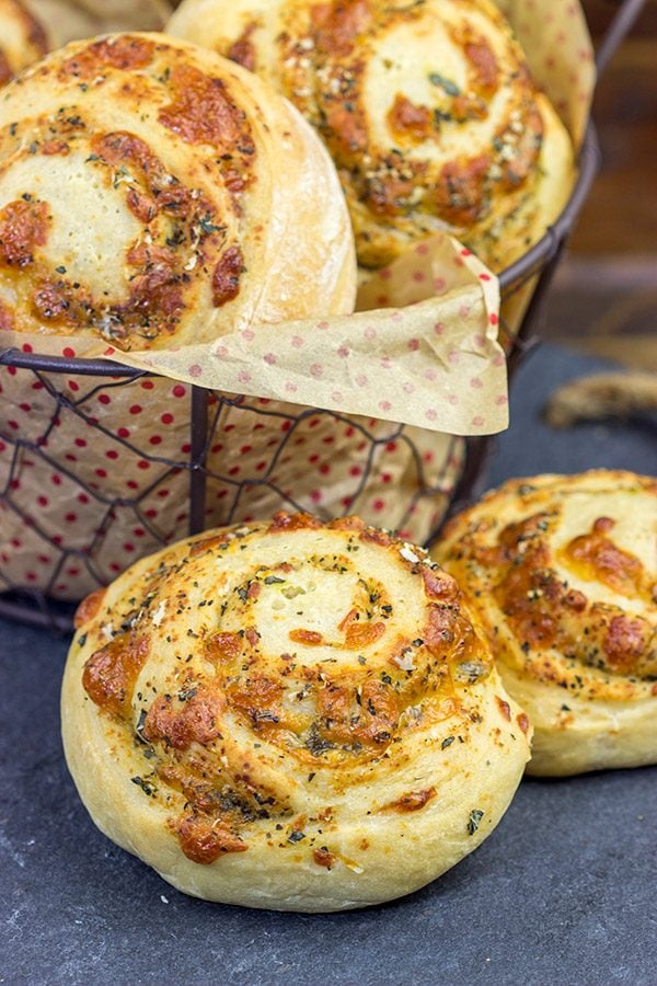 Instead of cinnamon and sugar, these Parmesan Cheese Rolls are stuffed with Italian herbs and cheeses...I dare you to eat just one!