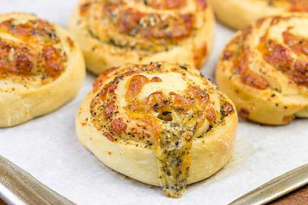 Instead of cinnamon and sugar, these Parmesan Cheese Rolls are stuffed with Italian herbs and cheeses...I dare you to eat just one!