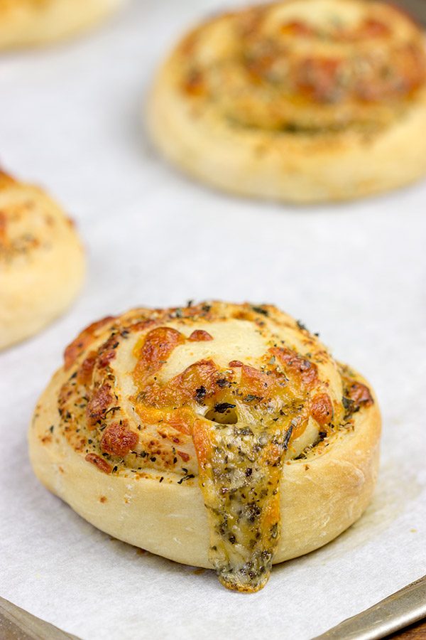 Instead of cinnamon and sugar, these Parmesan Cheese Rolls are stuffed with Italian herbs and cheeses...I dare you to eat just one!q