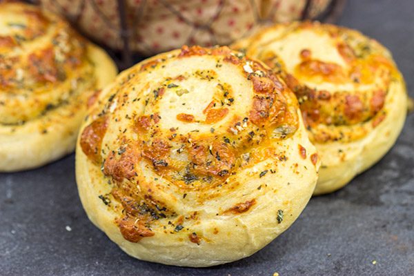 Instead of cinnamon and sugar, these Parmesan Cheese Rolls are stuffed with Italian herbs and cheeses...I dare you to eat just one!