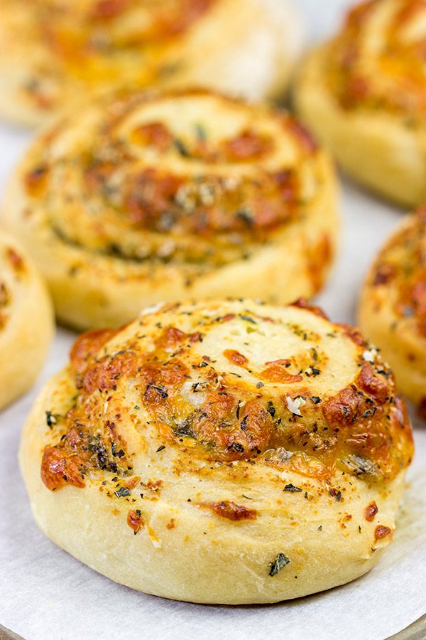 Instead of cinnamon and sugar, these Parmesan Cheese Rolls are stuffed with Italian herbs and cheeses...I dare you to eat just one!