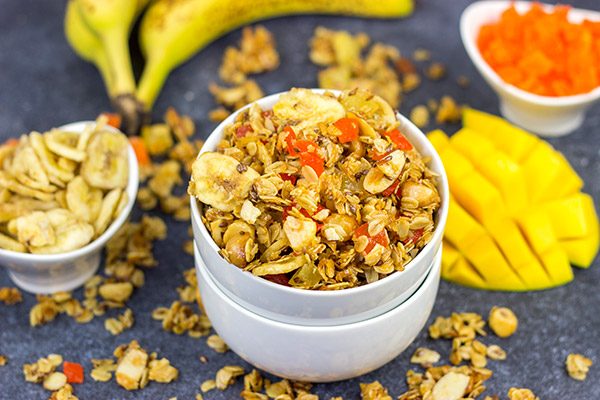 This Tropical Granola is packed with dried fruit, oats and nuts.  Add a spoonful to a bowl of yogurt for breakfast or just it plain as a mid-afternoon snack!