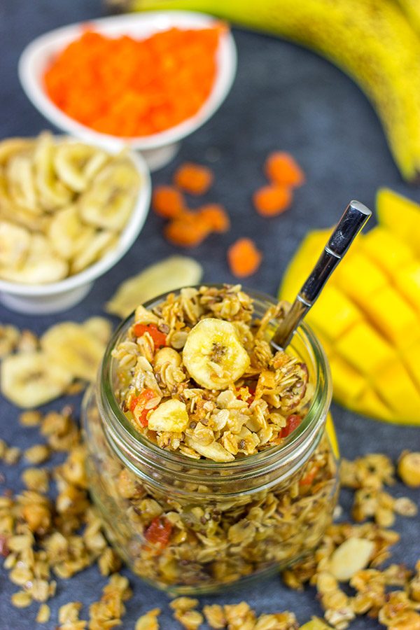 This Tropical Granola is packed with dried fruit, oats and nuts.  Add a spoonful to a bowl of yogurt for breakfast or just it plain as a mid-afternoon snack!