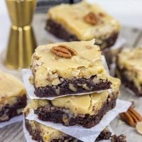 These Bourbon Pecan Brownies are a new favorite in our house! These chewy, chocolatey brownies are topped with a brown sugar + bourbon + pecan frosting...and the result is delicious!