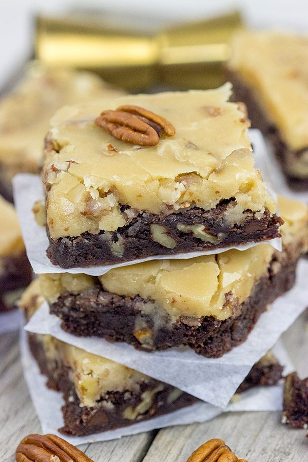 These Bourbon Pecan Brownies are a new favorite in our house! These chewy, chocolatey brownies are topped with a brown sugar + bourbon + pecan frosting...and the result is delicious!