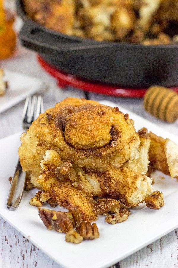 These Cast Iron Skillet Sticky Buns are topped with a tasty honey pecan glaze.  They're a surefire way to cure the winter blues!