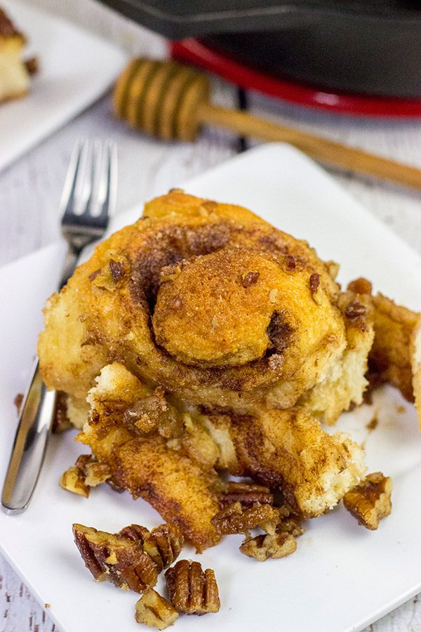 These Cast Iron Skillet Sticky Buns are topped with a tasty honey pecan glaze.  They're a surefire way to cure the winter blues!