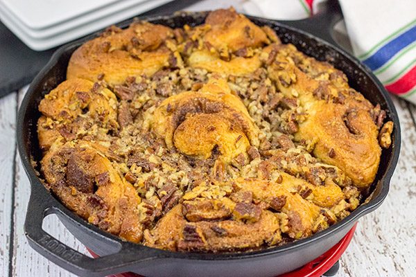 These Cast Iron Skillet Sticky Buns are topped with a tasty honey pecan glaze.  They're a surefire way to cure the winter blues!