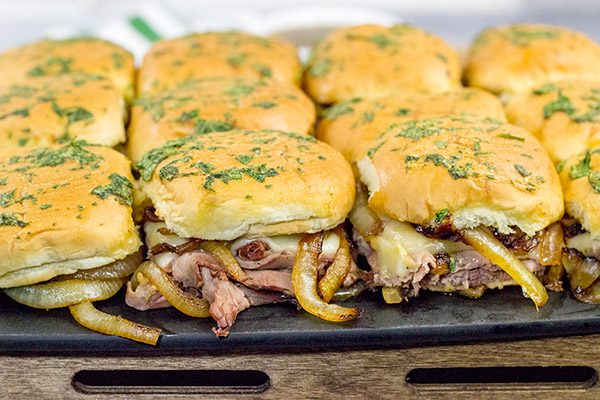 These French Dip Sliders use deli-sliced roast beef for a shortcut version of the classic.  The caramelized onions and au jus sauce are required, though!