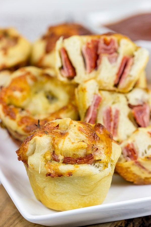 Muffin tins can be used for more than just breakfast! These Muffin Tin Stromboli are packed with Italian meats and cheeses, and they're the perfect football appetizer!