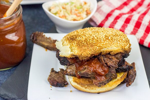 Slow-smoked until tender and juicy, this Smoked Beef Chuck Roast is served with a (surprisingly easy) Maple Bourbon BBQ Sauce!